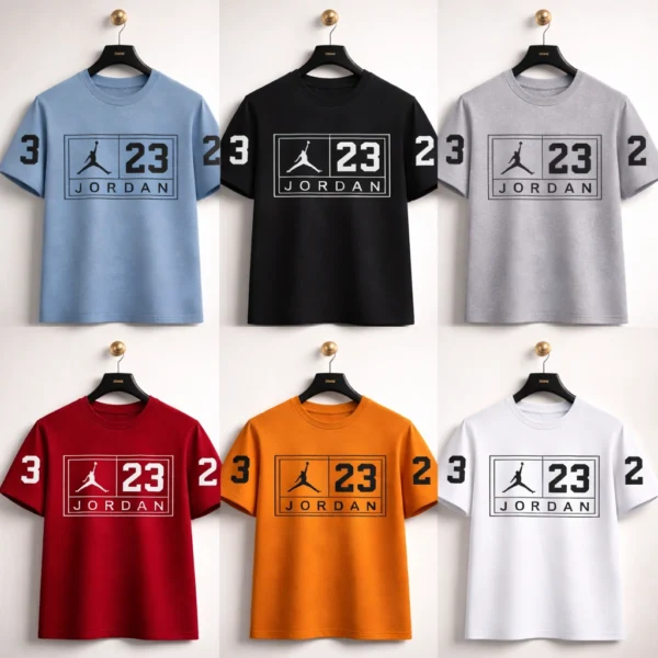 JORDAN OVERSIZED DROP SHOULDER TSHIRT for men and women hanging against a textured wall, featuring a white 23 Jumpman graphic.